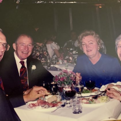 Four older adults sit at a table, from left, two white males next to two white females, all in formal attire, Eager recipients of mail-order ice cream